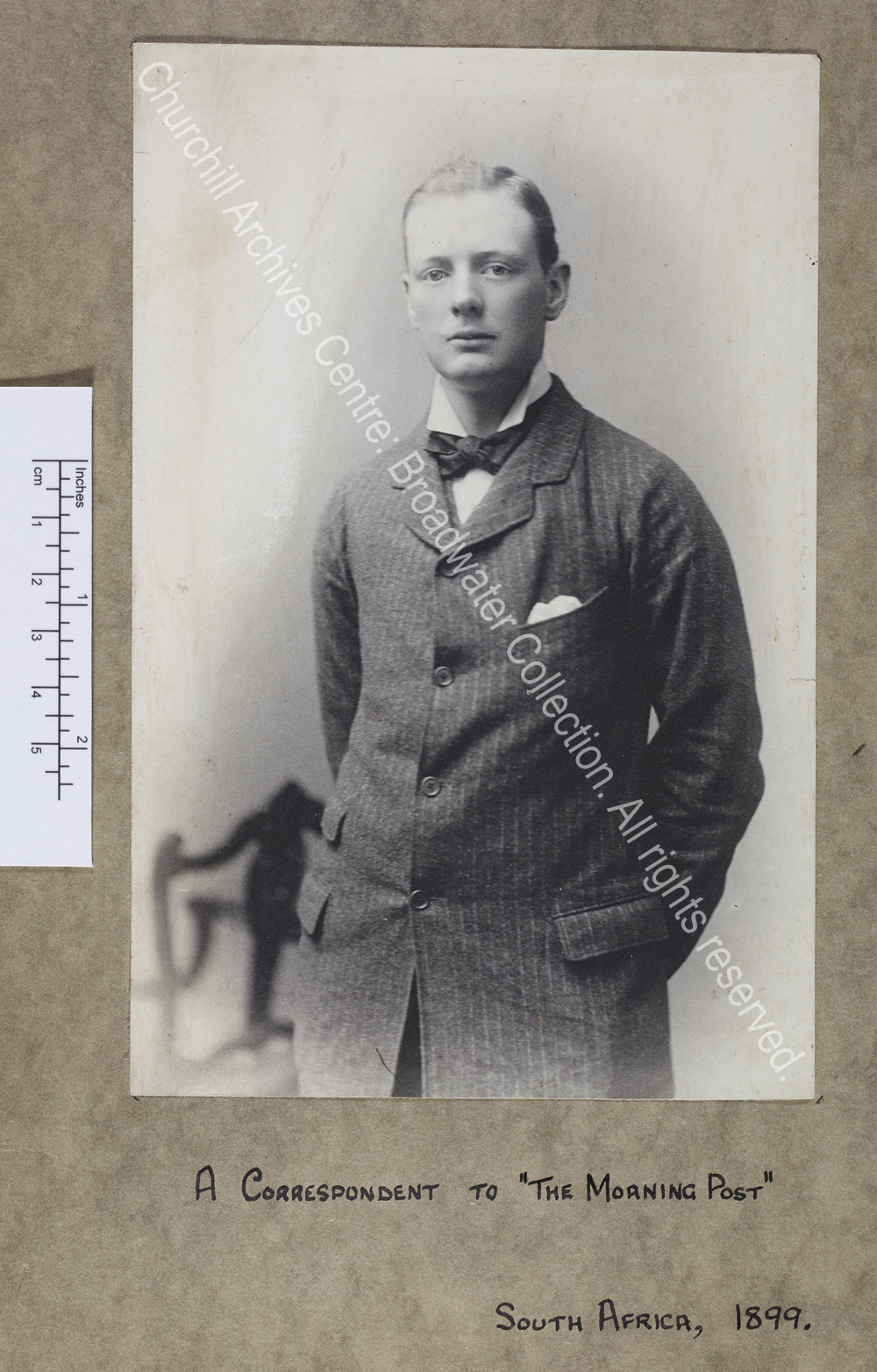 Three-quarter length photograph of WSC standing facing the camera at a slight angle