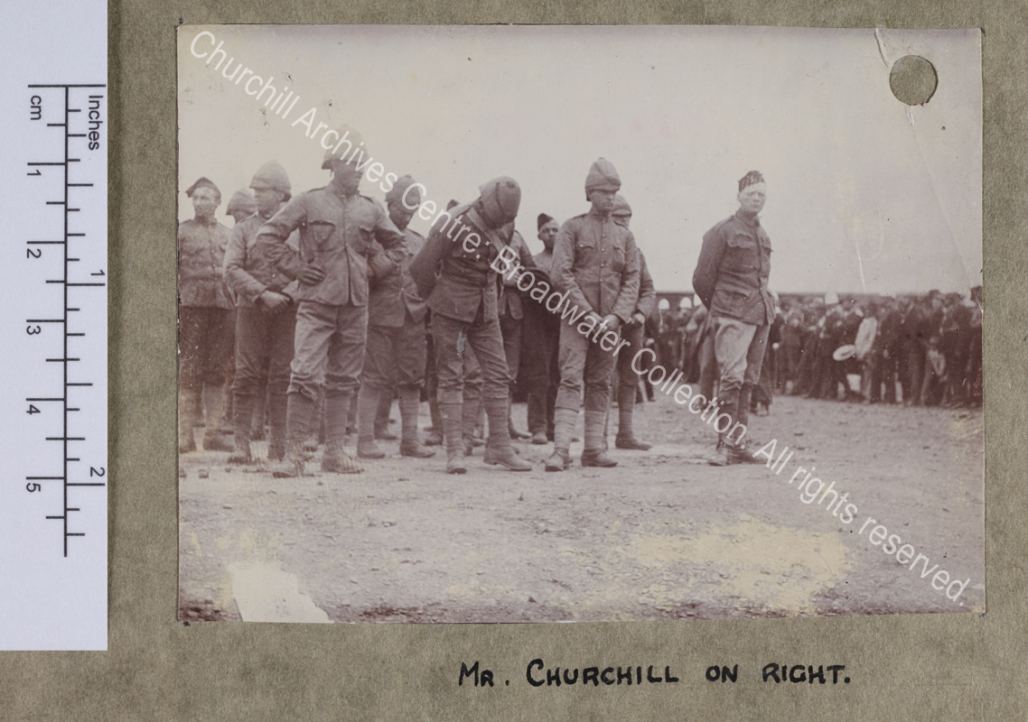 Photograph of WSC standing with other prisoners during the Boer War in [Pretoria