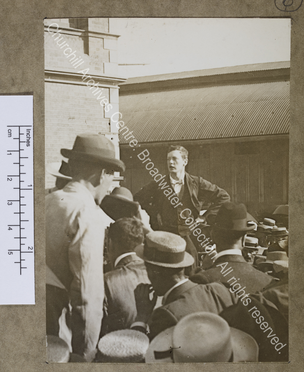 Photograph of WSC standing with his hands on his hips