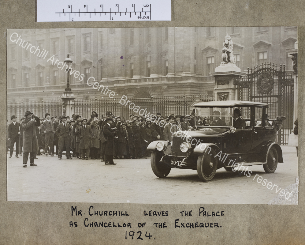 Photograph of WSC (who is just visible) in the back of a Wolseley car (registration XO 7385)