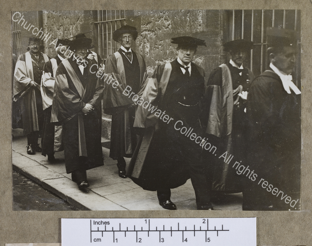 Full-length photograph of WSC walking in procession with others receiving honorary degrees