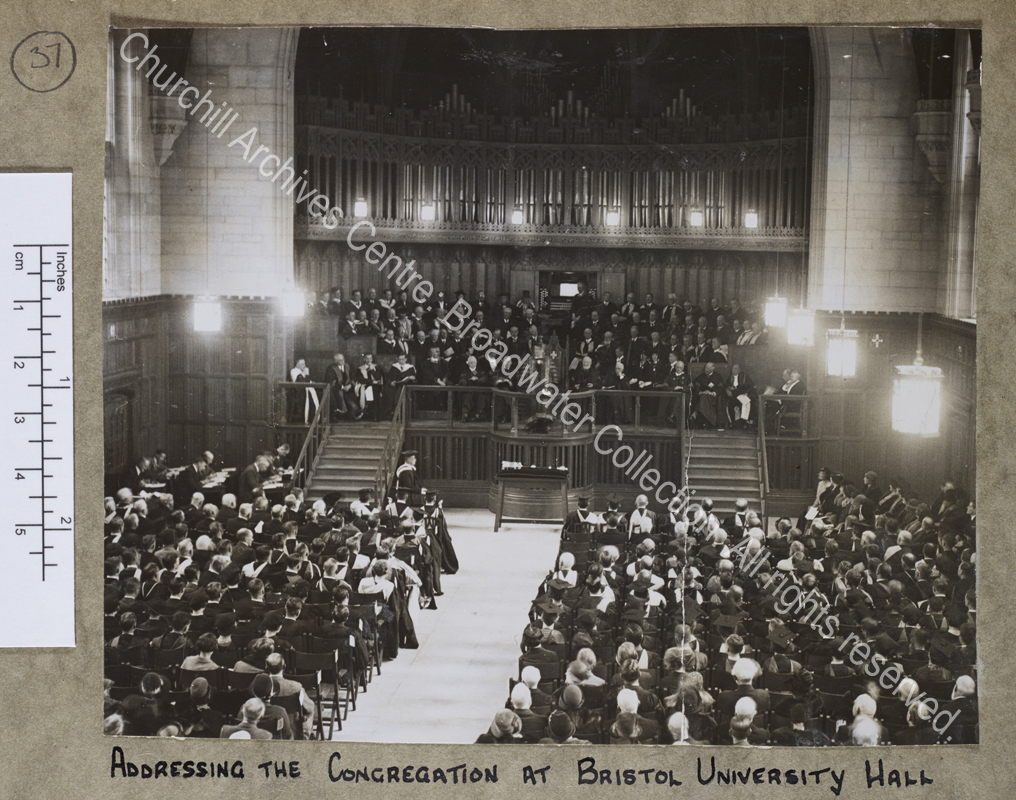 Photograph of WSC (taken from the other end of the hall) in his Chancellor's robes