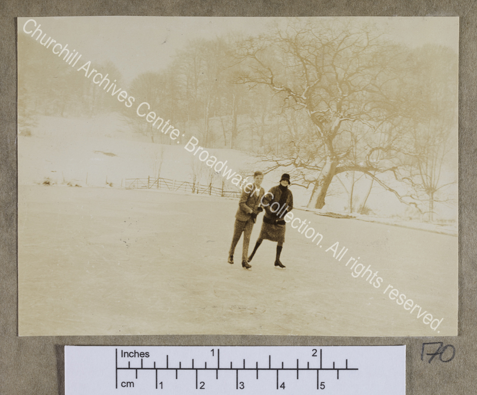 Photograph of CSC and Randolph Churchill skating on a frozen lake at Chartwell [Kent]