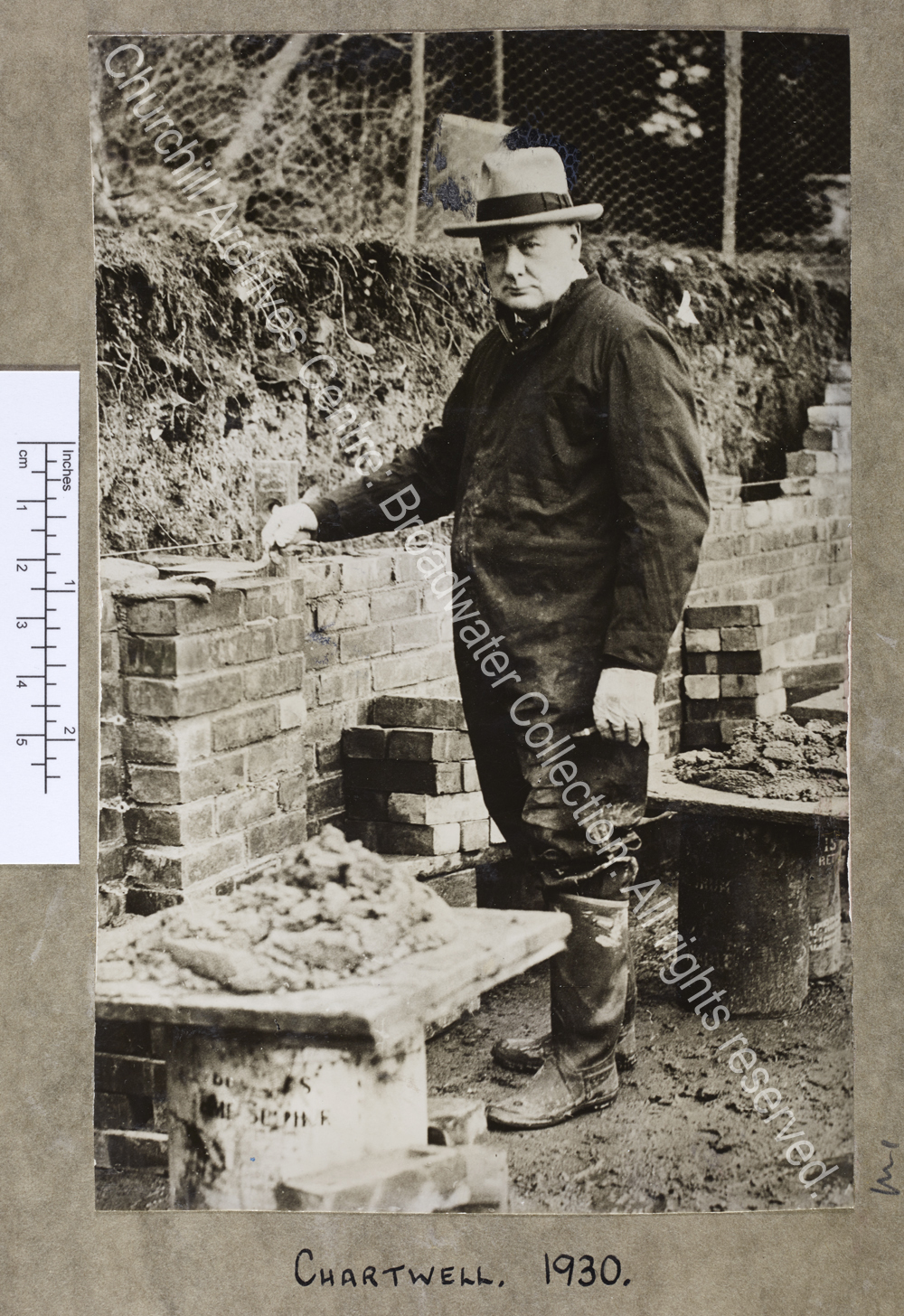 Full length photograph of WSC building a wall at Chartwell [Kent]