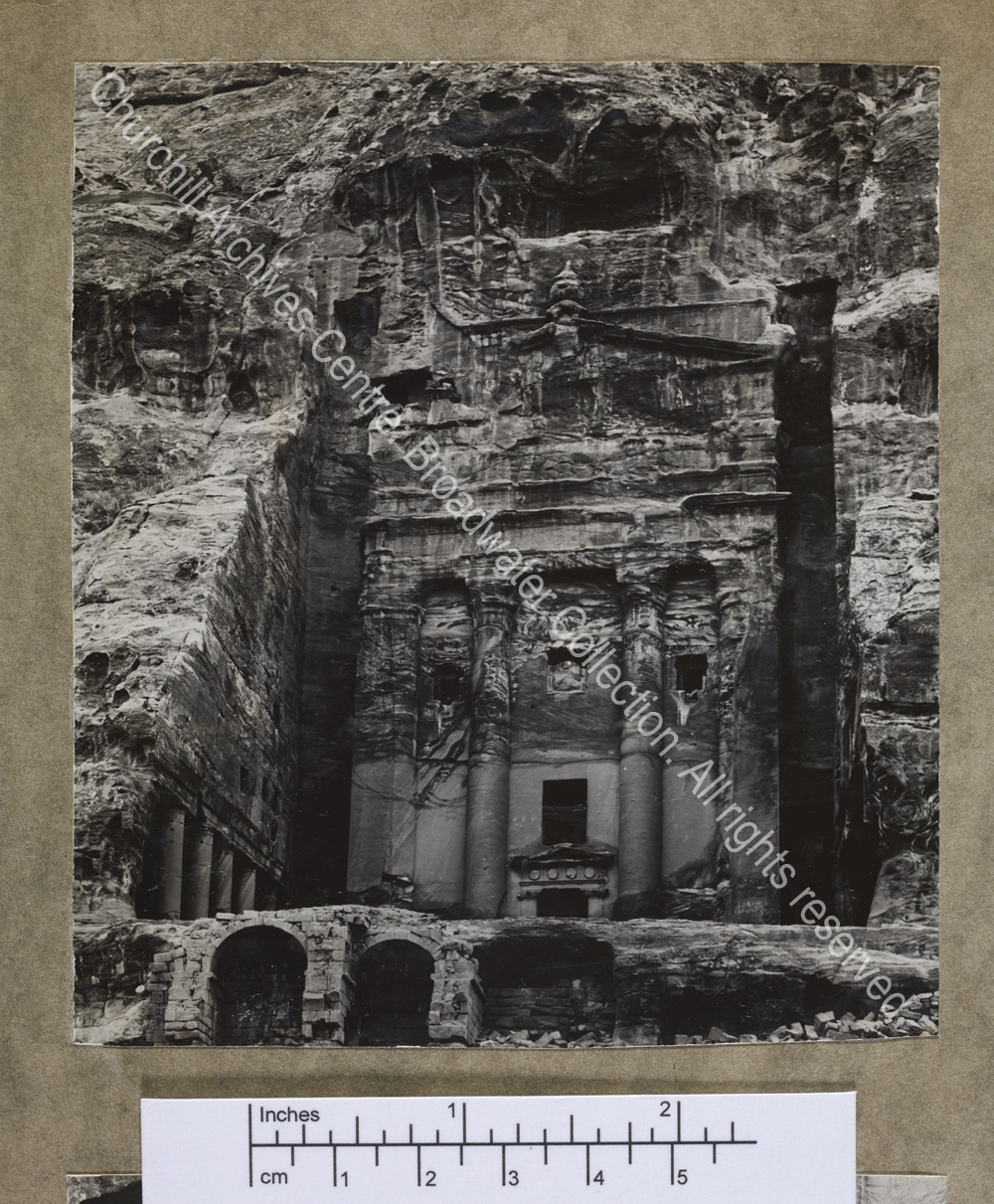 Photograph of a building carved into rock at [Jordan]