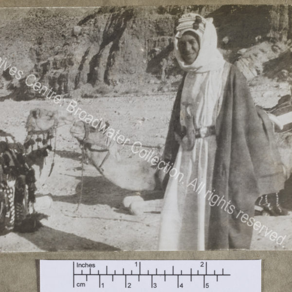 Three quarter length photograph of T E Lawrence ["Lawrence of Arabia"