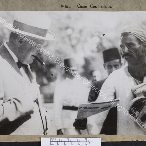 Half length photograph of WSC with an Arab newspaper seller in Cairo [Egypt]