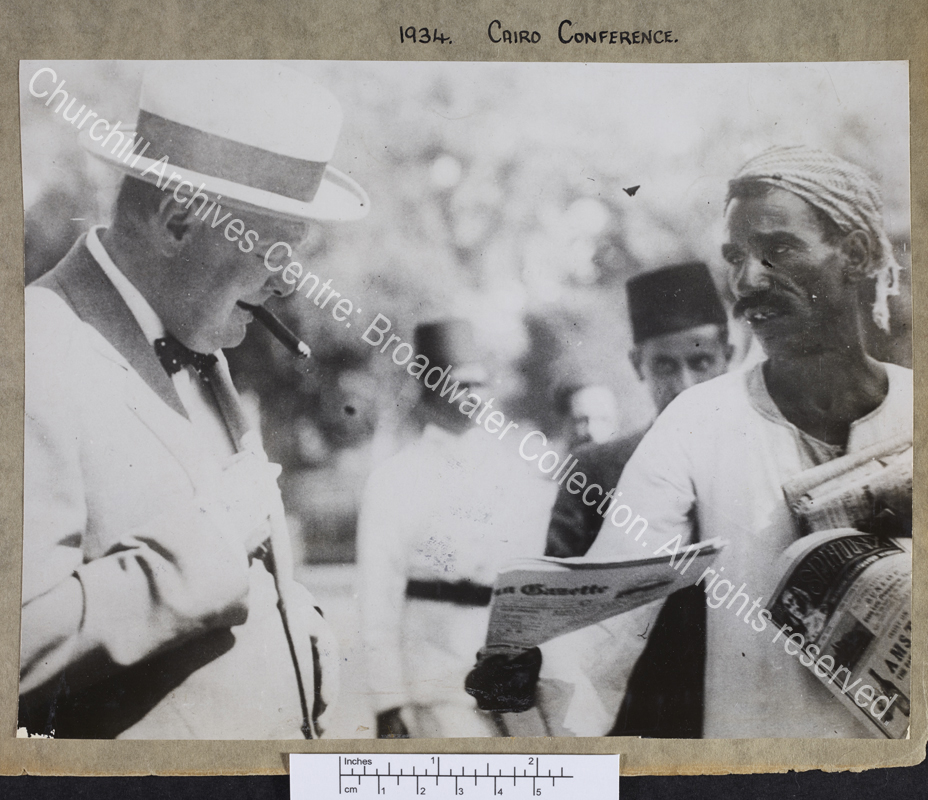 Half length photograph of WSC with an Arab newspaper seller in Cairo [Egypt]